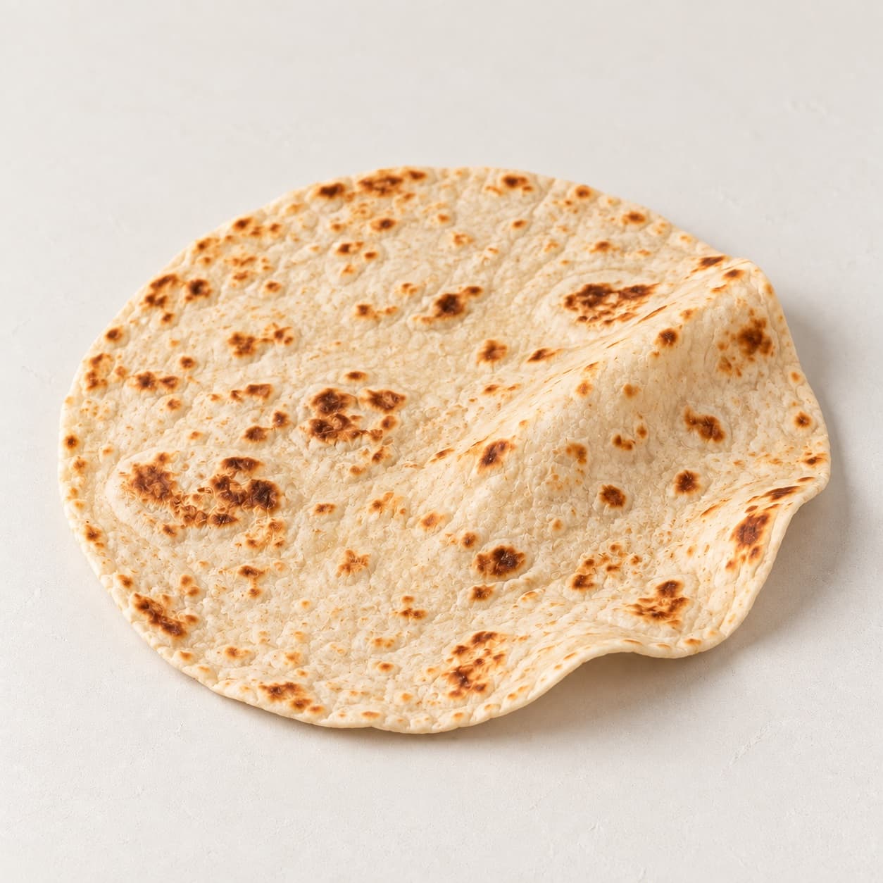A toasted gluten-free tortilla, the wrap for the bōm-rrito breakfast burrito at bōm dough, Cambridge, MA.