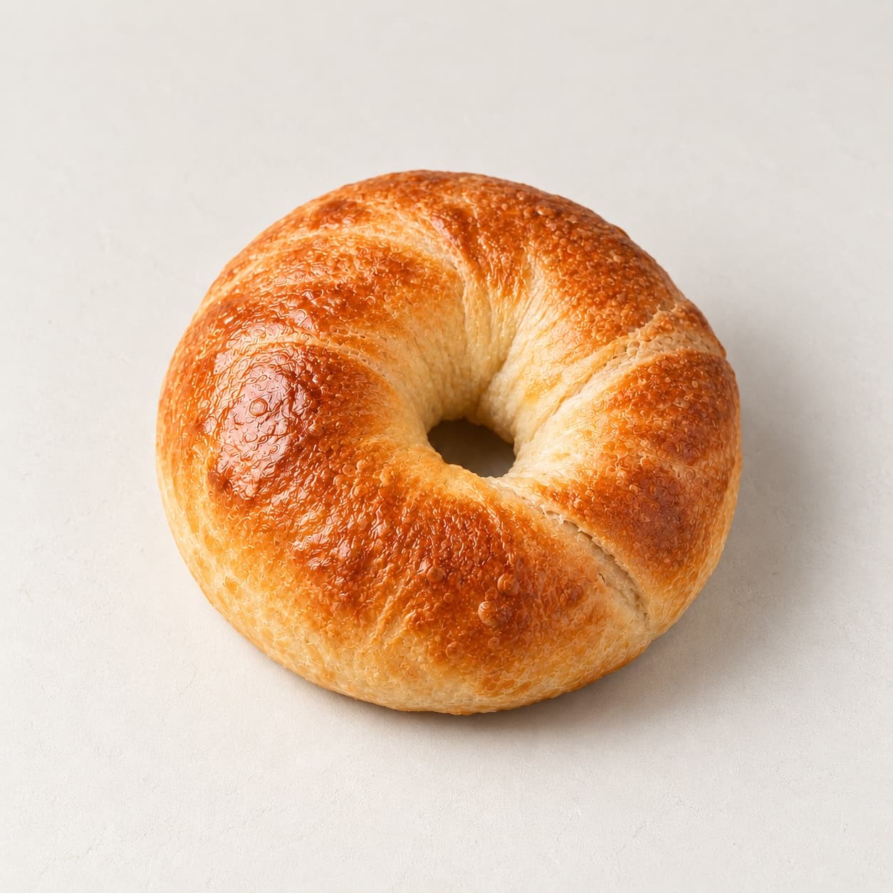 A New York–style bagel for breakfast sandwiches at bōm dough, Cambridge, MA.