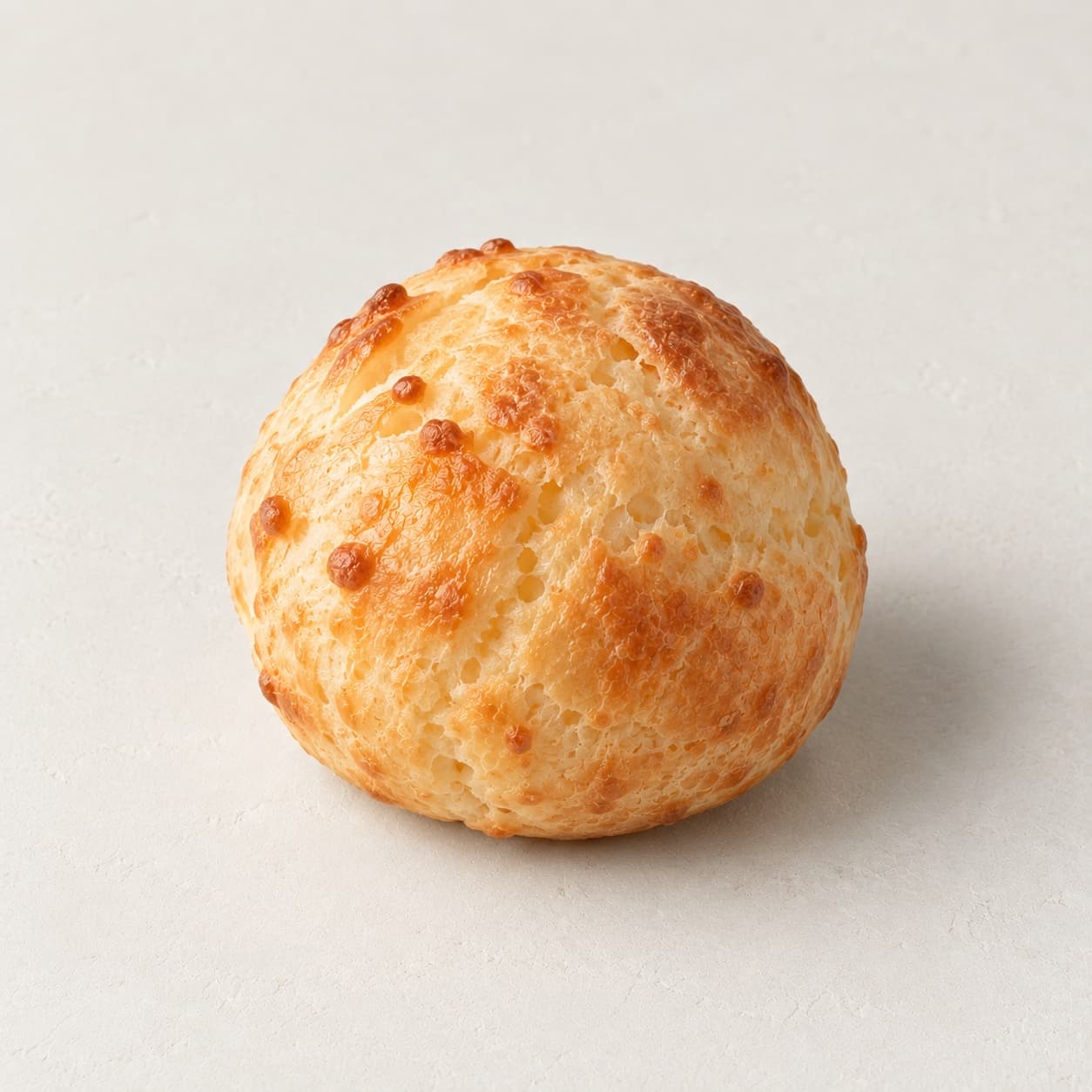 Pão de queijo, gluten-free Brazilian cheese bread, baked fresh at bōm dough in Cambridge, MA.